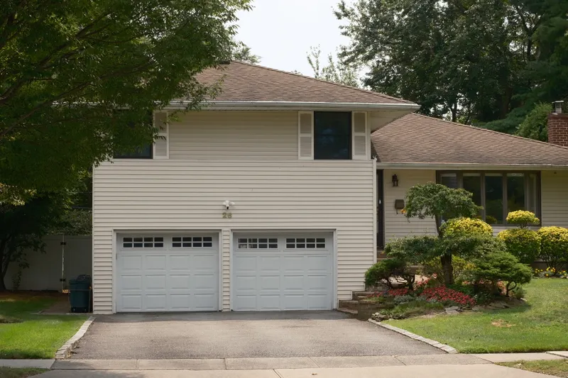 Suburban home with a double residential garage door